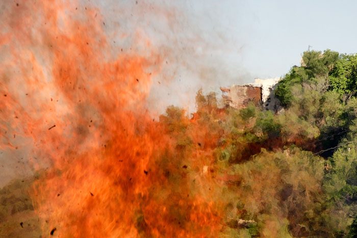 Flames from burn pile in Jerome Arizona